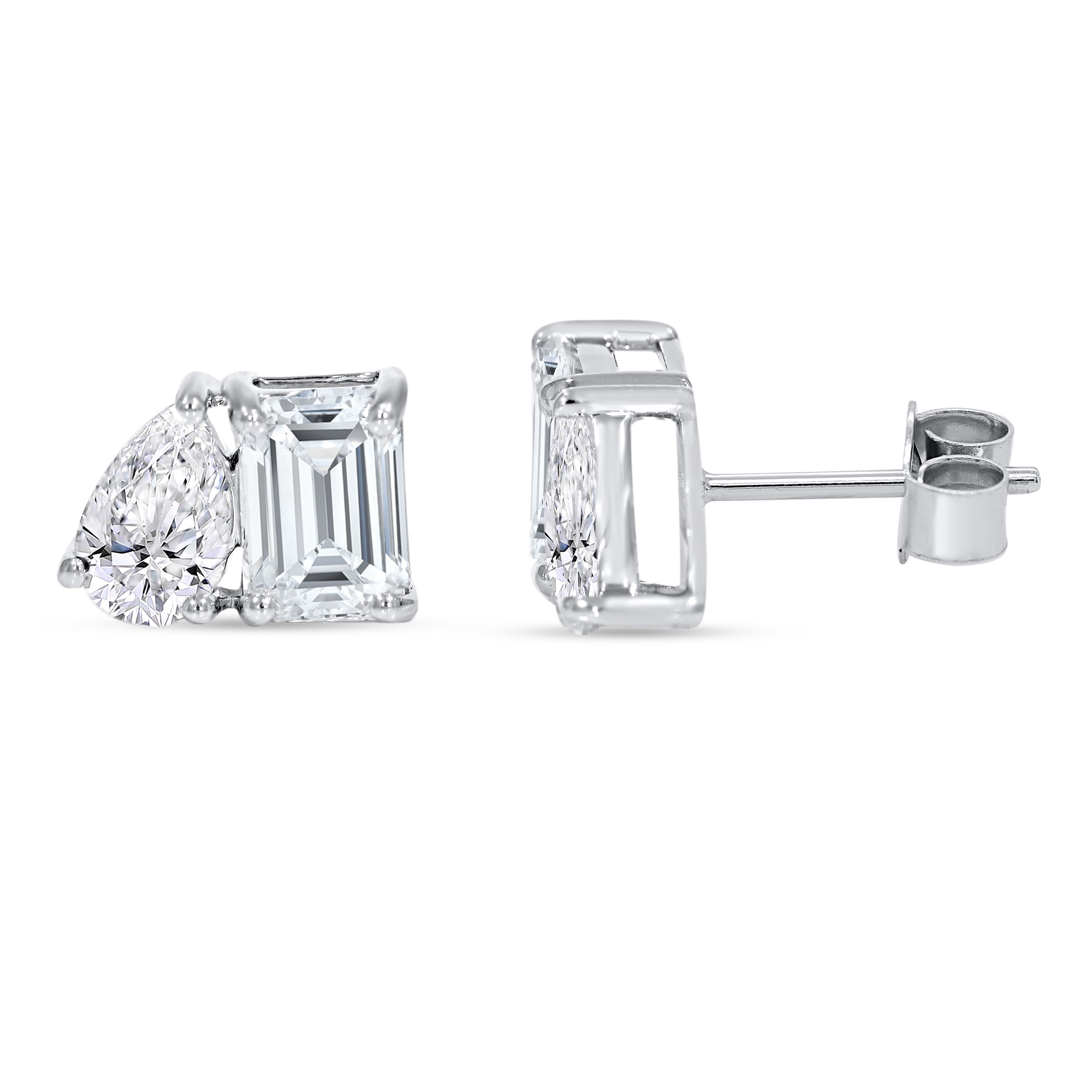 3.02 CTW lab grown diamond Toi et Moi stud earrings in 14K white gold featuring emerald cut and pear shape diamonds.